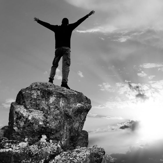 Man on top of mountain. Conceptual design.